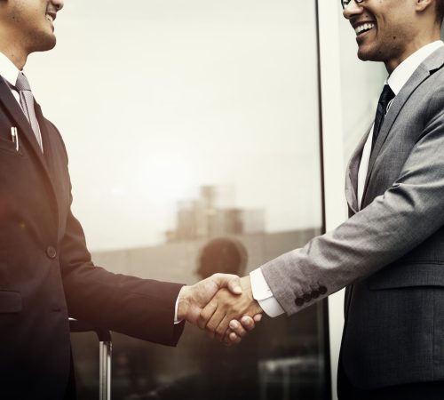 Corporate businessmen shaking hands